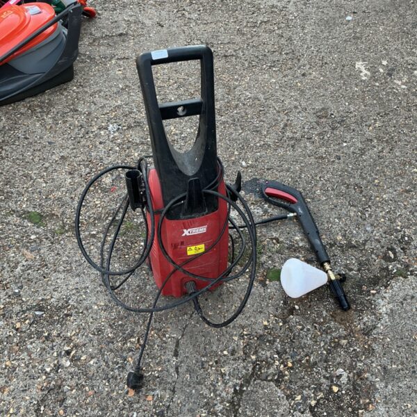 Red PowerBase Xtreme pressure washer with hose and lance.
