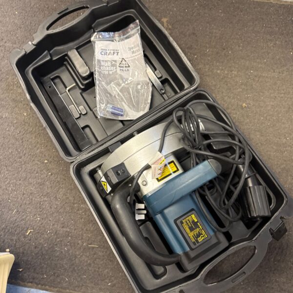 Powercraft 1700w wall chaser in open carrying case.