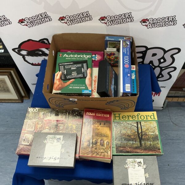Boxed puzzle and game lot including Waddingtons and Autobridge.