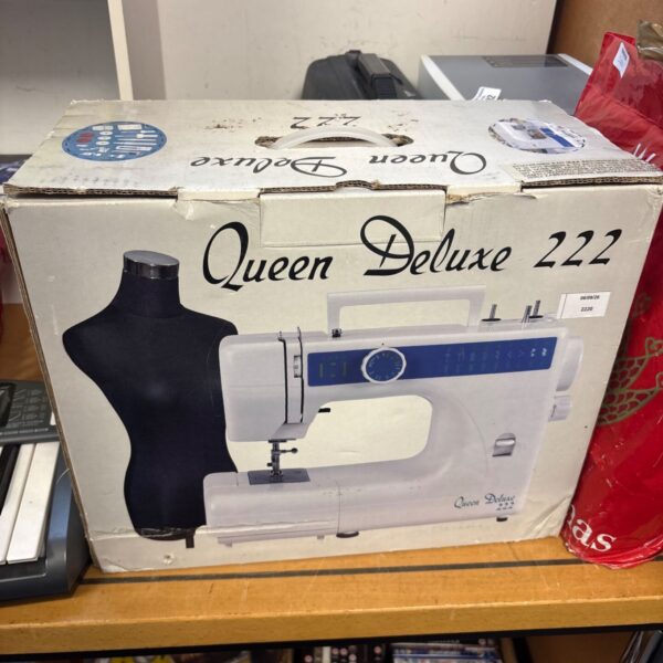 Vintage Queen Deluxe 222 sewing machine in its original box.