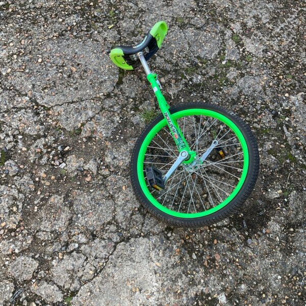Vibrant Raptor unicycle with a single wheel, ideal for outdoor cycling.