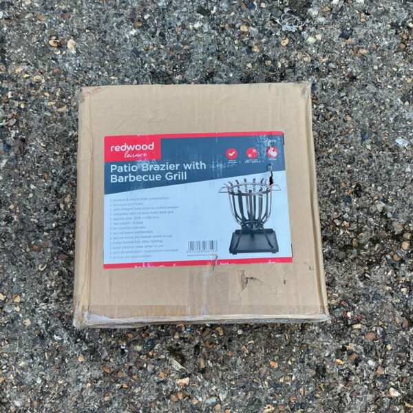 Redwood BBQ grill in original packaging, ready for outdoor cooking.