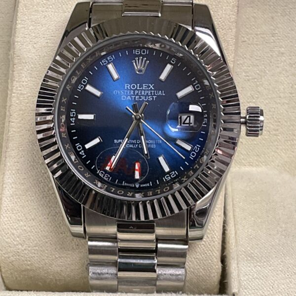 Close-up of replica Rolex Datejust watch with blue dial.