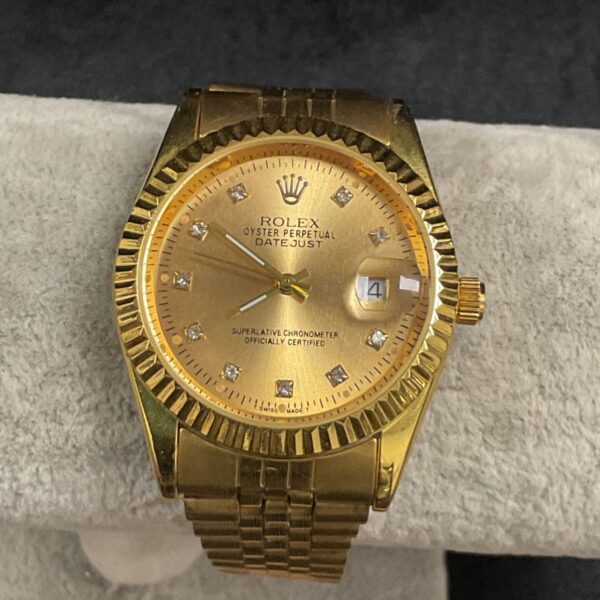 Gold tone replica Rolex Oyster Perpetual Datejust watch.