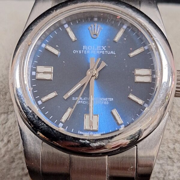Replica Rolex quartz ladies wristwatch with a blue dial.