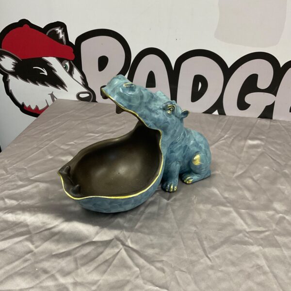 Close-up of a resin hippo key holder ornament.