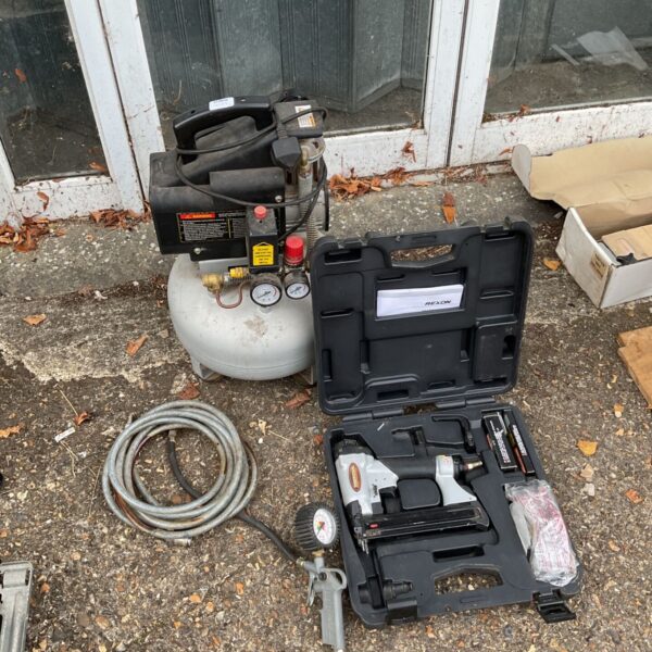 Rexon air compressor with Tradesman nailer and hose.