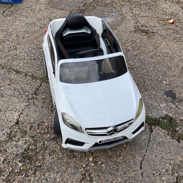 White ride on Mercedes AMG car for children's play.