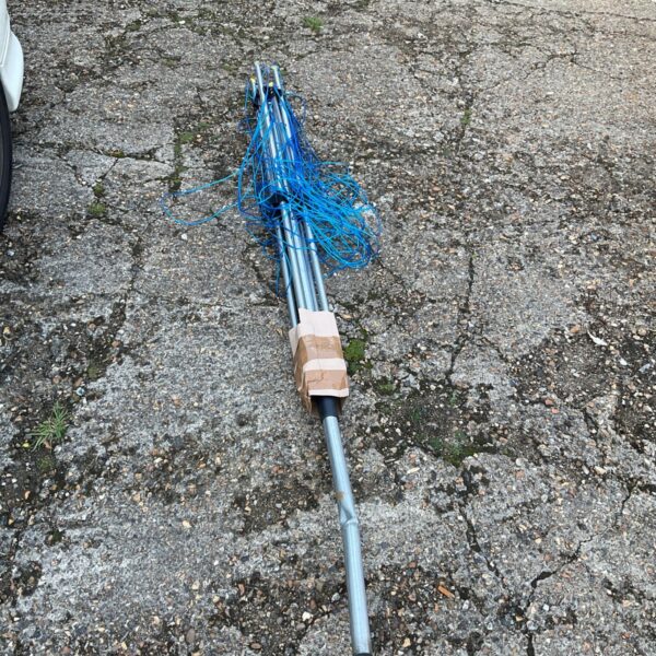 Damaged aluminium rotary clothes airer for garden laundry drying.