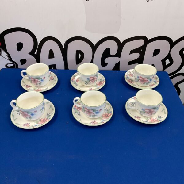 Six Royal Doulton Expressions tea cups and saucers displayed.