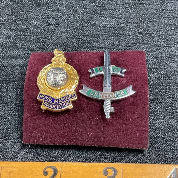 Pair of Royal Marines Commando pin badges, detailed military collectables.