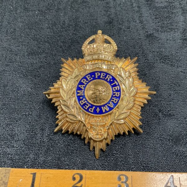 Detailed brass Royal Marines helmet plate with Kings Crown.