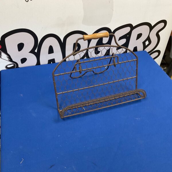 Rustic wire recipe book holder for kitchen organisation.