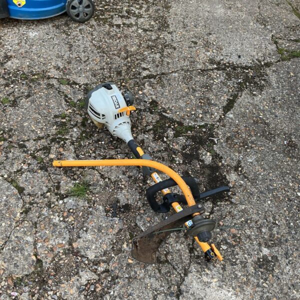 Used Ryobi petrol strimmer for garden maintenance and landscaping.