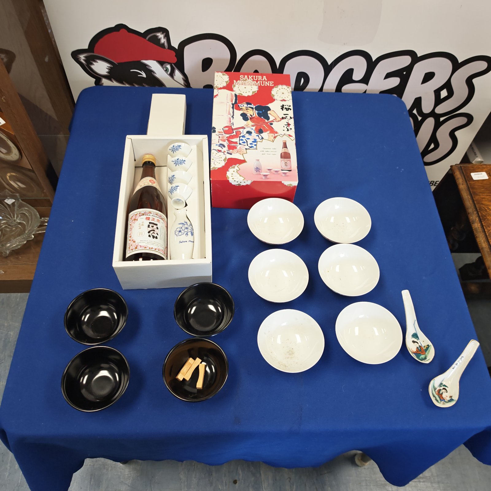 Vintage Sakura Masamune sake set with porcelain bowls displayed.