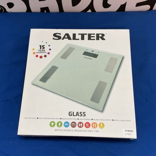 Vintage Salter bathroom scale with circular face and fifteen-year guarantee.