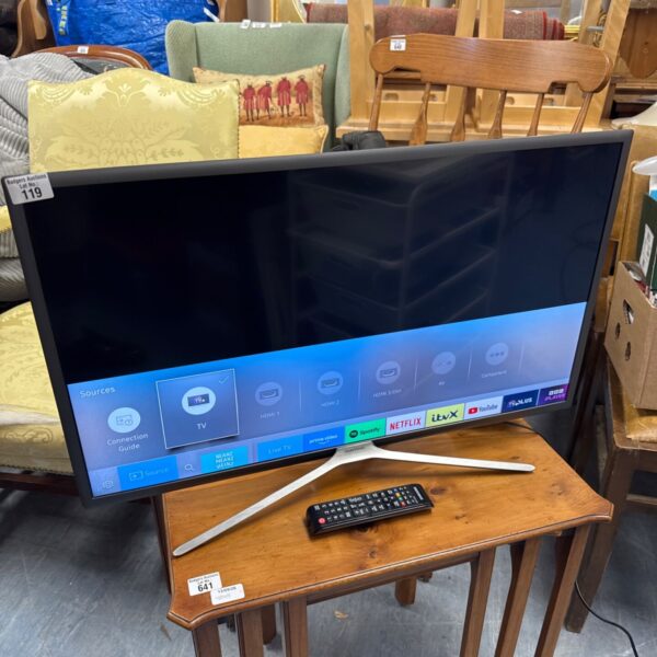 Samsung 32 inch smart TV with remote control displayed.