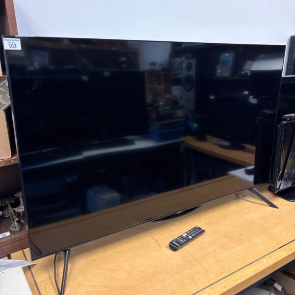 Samsung 50 inch QE50Q60TA television with remote control.