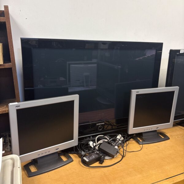 Samsung 42’ plasma TV and two AOC monitors in a lot.
