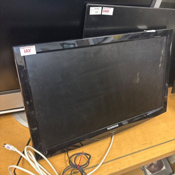 Samsung flat screen TV with wooden bracket attached to the back.