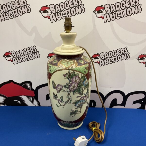 Vintage Satsuma table lamp with floral and butterfly design.