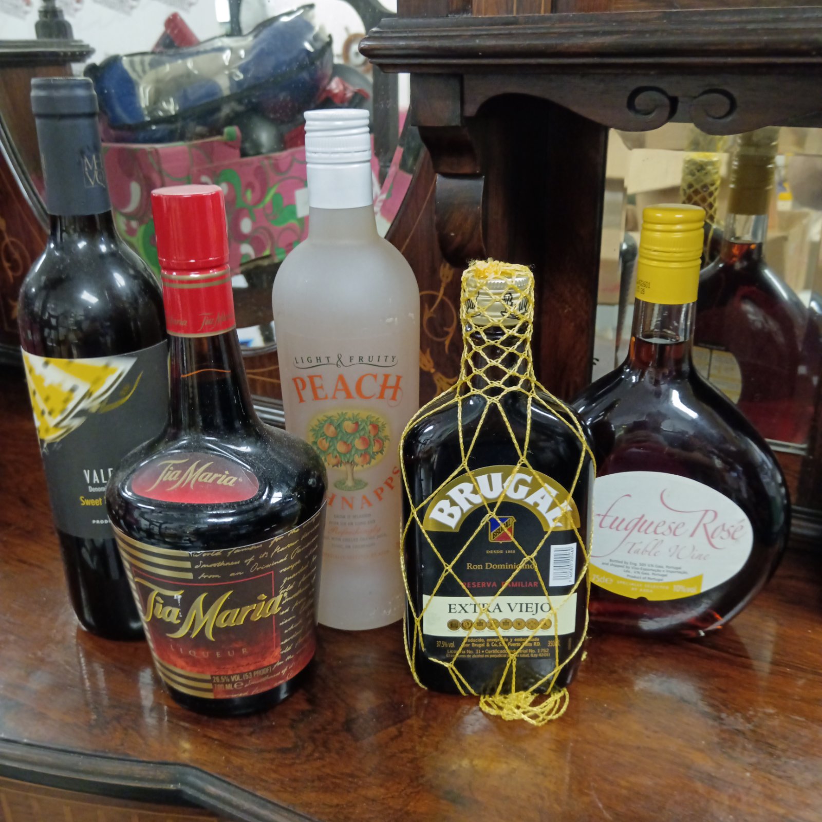 Sealed alcohol bottles lot including Brugal and Tia Maria.