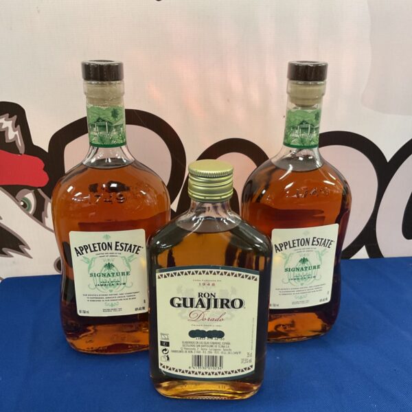 Sealed bottles of Appleton Estate and Ron Guajiro rum for collectors.