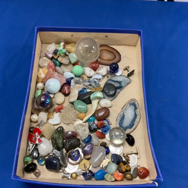 Tray of semi precious stones and polished rocks for crafting.