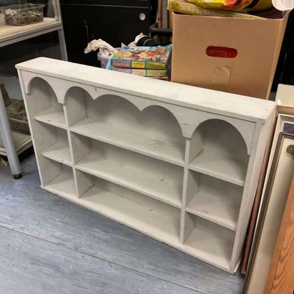Shabby chic shelving unit with pigeon holes for rustic storage.