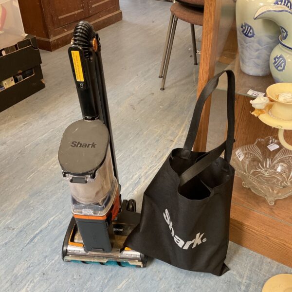 Shark DuoClean PowerFins cordless vacuum cleaner with charger.