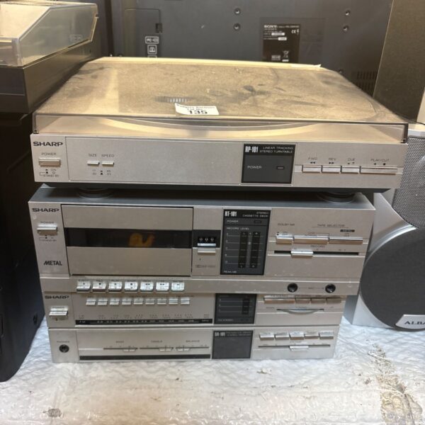 Vintage Sharp RP-101 stereo system with turntable and cassette deck.