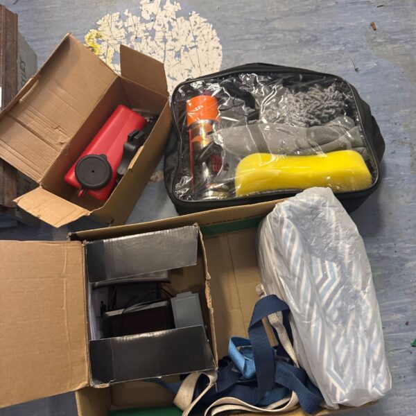 Shed clearance lot with car cleaning kit and security light.