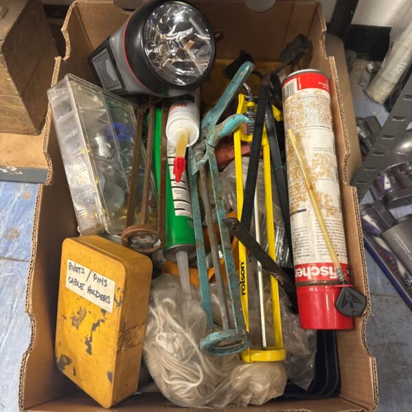 Tray of mixed shed clearance tools including mastic guns and hand tools.