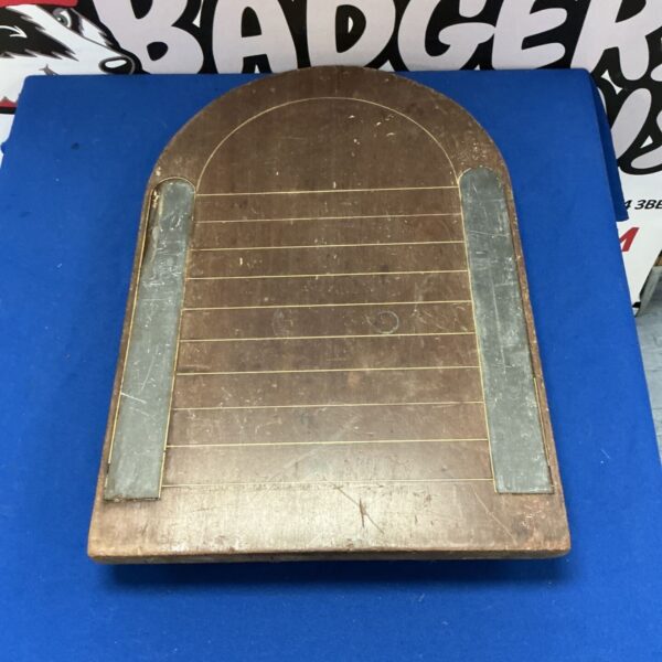 Antique shove ha’penny board with faded paint and worn wood.