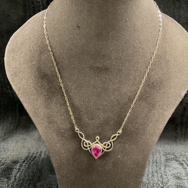 Silver Celtic pendant necklace with amethyst gemstone.
