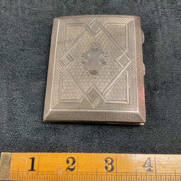 Vintage silver cigarette case with Art Deco design.