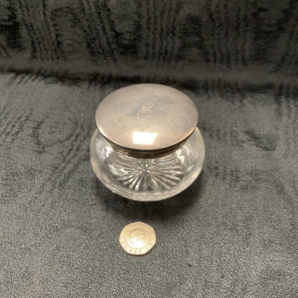 Antique silver lidded glass dressing table pot with hallmarked lid.
