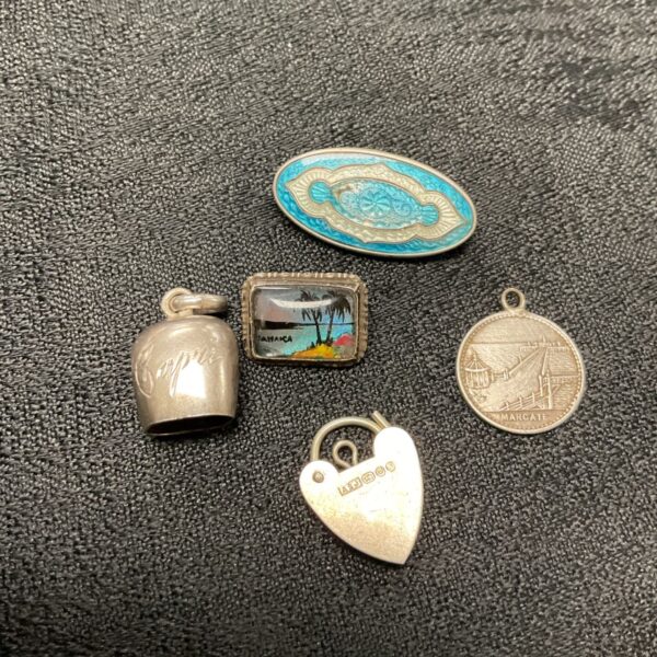 Antique silver padlock and enamel brooch, vintage jewellery collection.