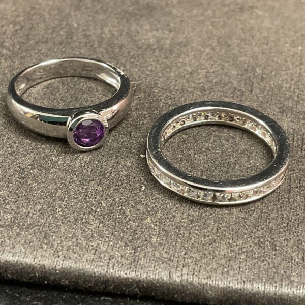 Silver rings with purple and white stones, size M.