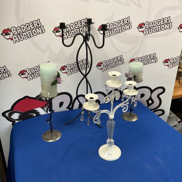 Ornate silver-tone candelabra set for elegant table displays.