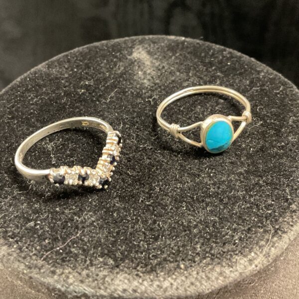 Silver rings with turquoise and black stones, size O.