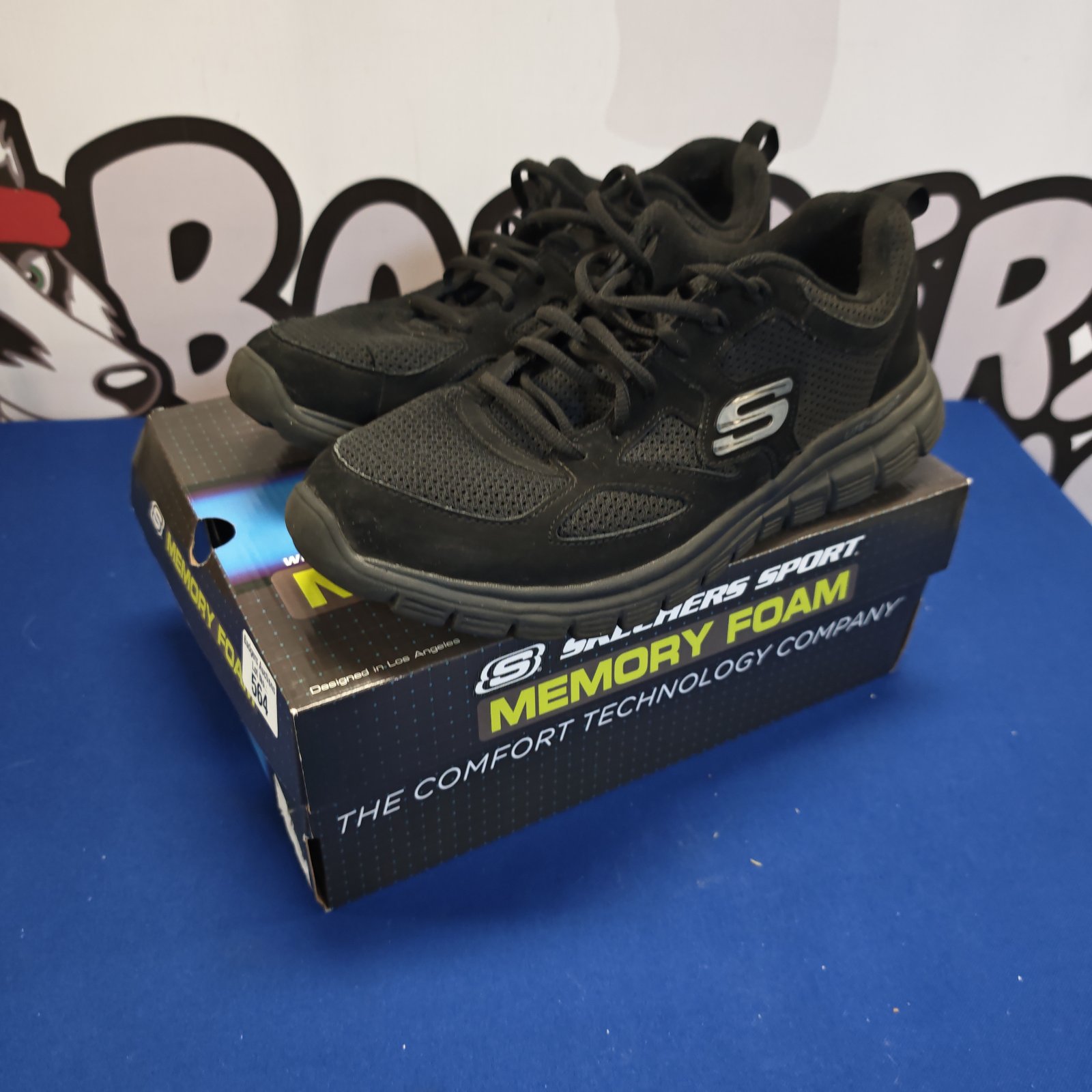 Black Skechers trainers size 10.5 with memory foam cushioning.