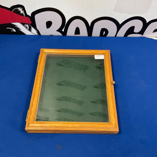Vintage small wooden display case with glass front for collectibles.