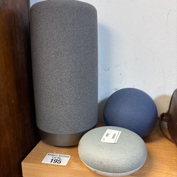 Grey Google Home smart speaker on a table.