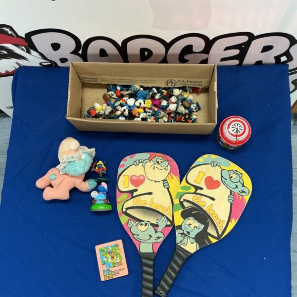 Vintage Smurfs memorabilia bundle with figurines and puzzle.