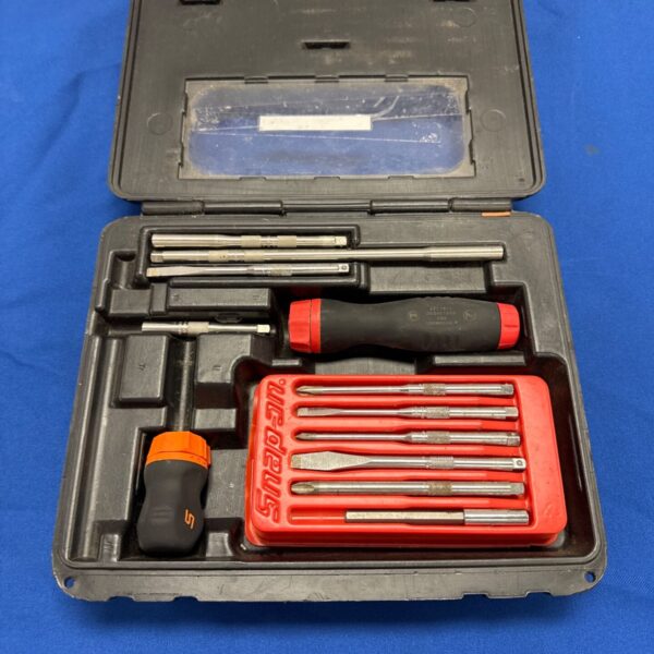 Snap On screwdriver set in open case with various bits visible.