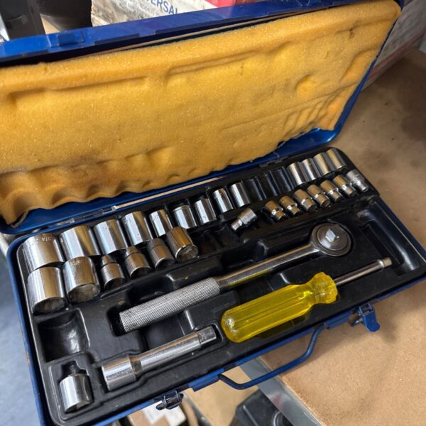 Blue case containing a part complete 3/8” drive socket and ratchet set.
