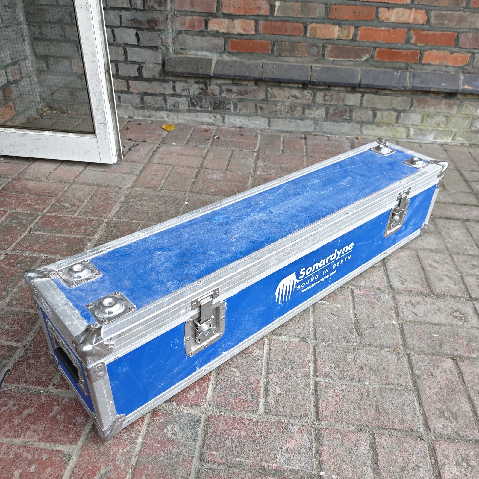 Blue Sonardyne 4ft flight case with metal edging and clasps.
