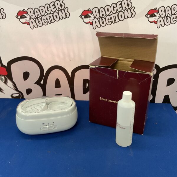 White sonic jewellery cleaner with on/off switch.