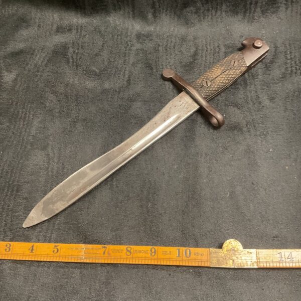 Vintage Spanish Bolo bayonet with wood handle and metal blade.